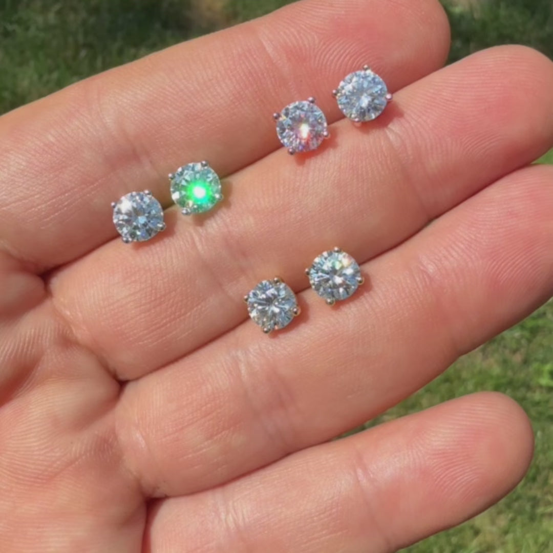 Load video: 2ct moissanite earrings. Iced out earrings that pass the diamond tester.