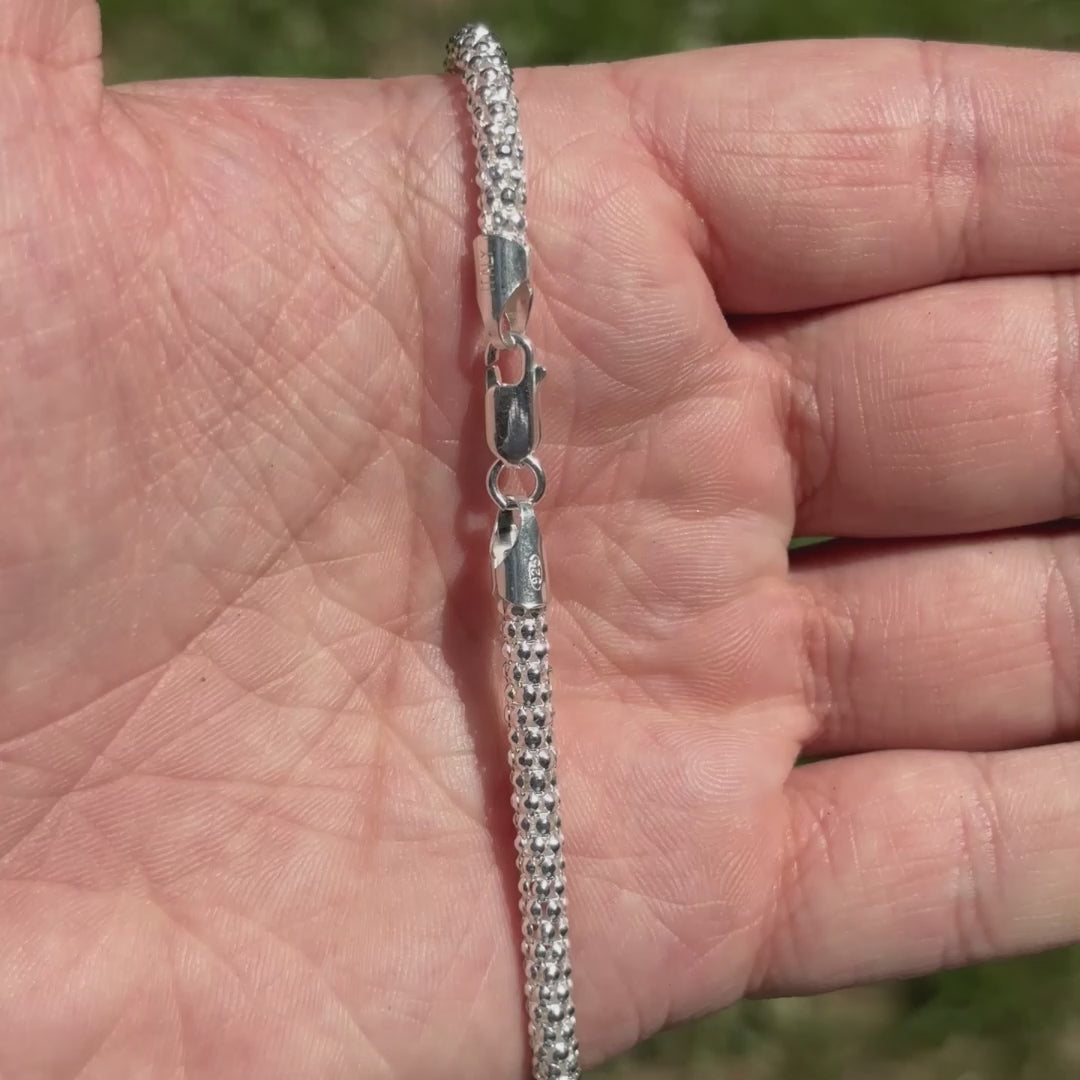 Load video: The 4mm popcorn chain is a greta mens 925 sterling silver chain. Very shiny and polished to reflect the light.